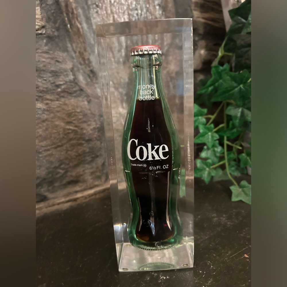 Vintage Coca Cola glass bottle encased in glass